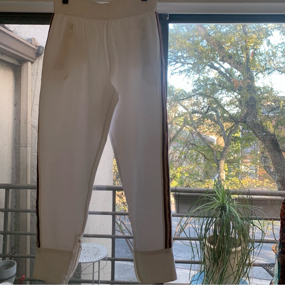 FLANNEL White cotton joggers with zippered pockets and red and gold side stripes